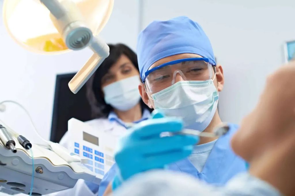 Dentist performing advanced dental treatment at the best dental clinic in Kochi